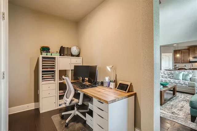a kitchen with stainless steel appliances kitchen island granite countertop a sink refrigerator and cabinets