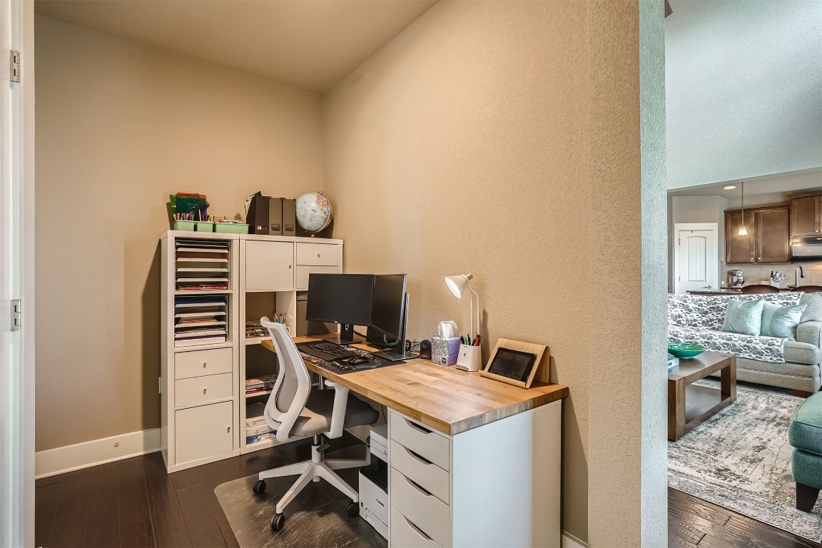 9401 McKnight Loop, Unit 6 Austin, TX 78717 - Photo 9 of 28 a workspace with furniture and wooden floor