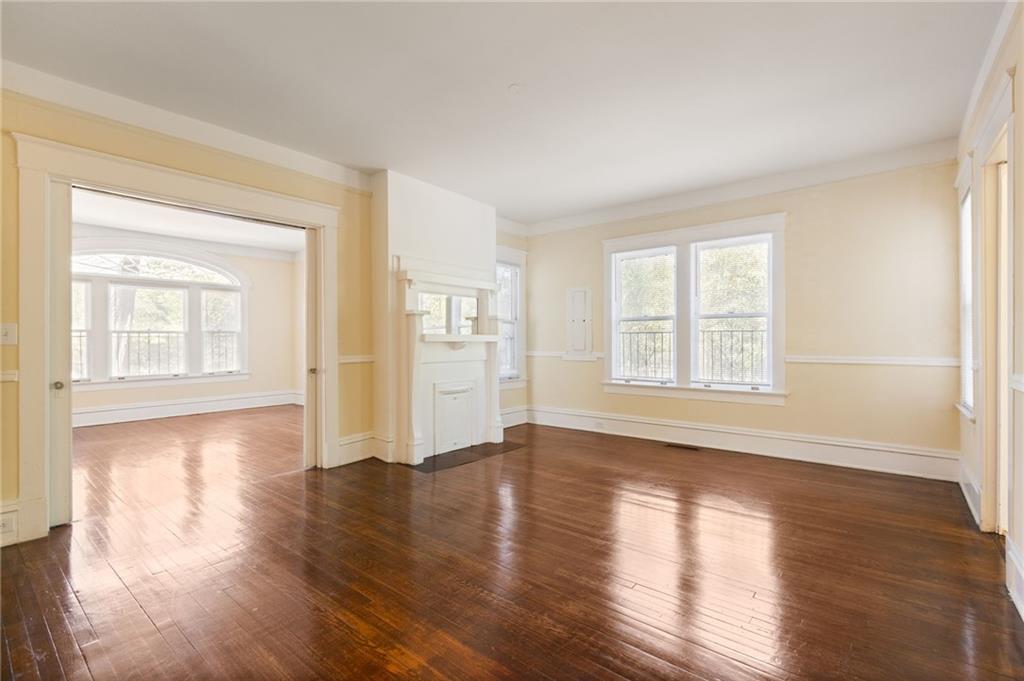 120 South Candler Street Decatur, GA 30030 - Photo 12 of 40 a view of empty room with wooden floor and fan