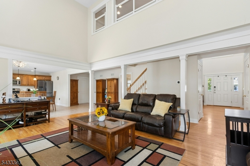 33 Stanton Street Clark, NJ 07066 - Photo 7 of 37 a living room with furniture and a fireplace