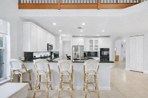 a kitchen with cabinets and sink