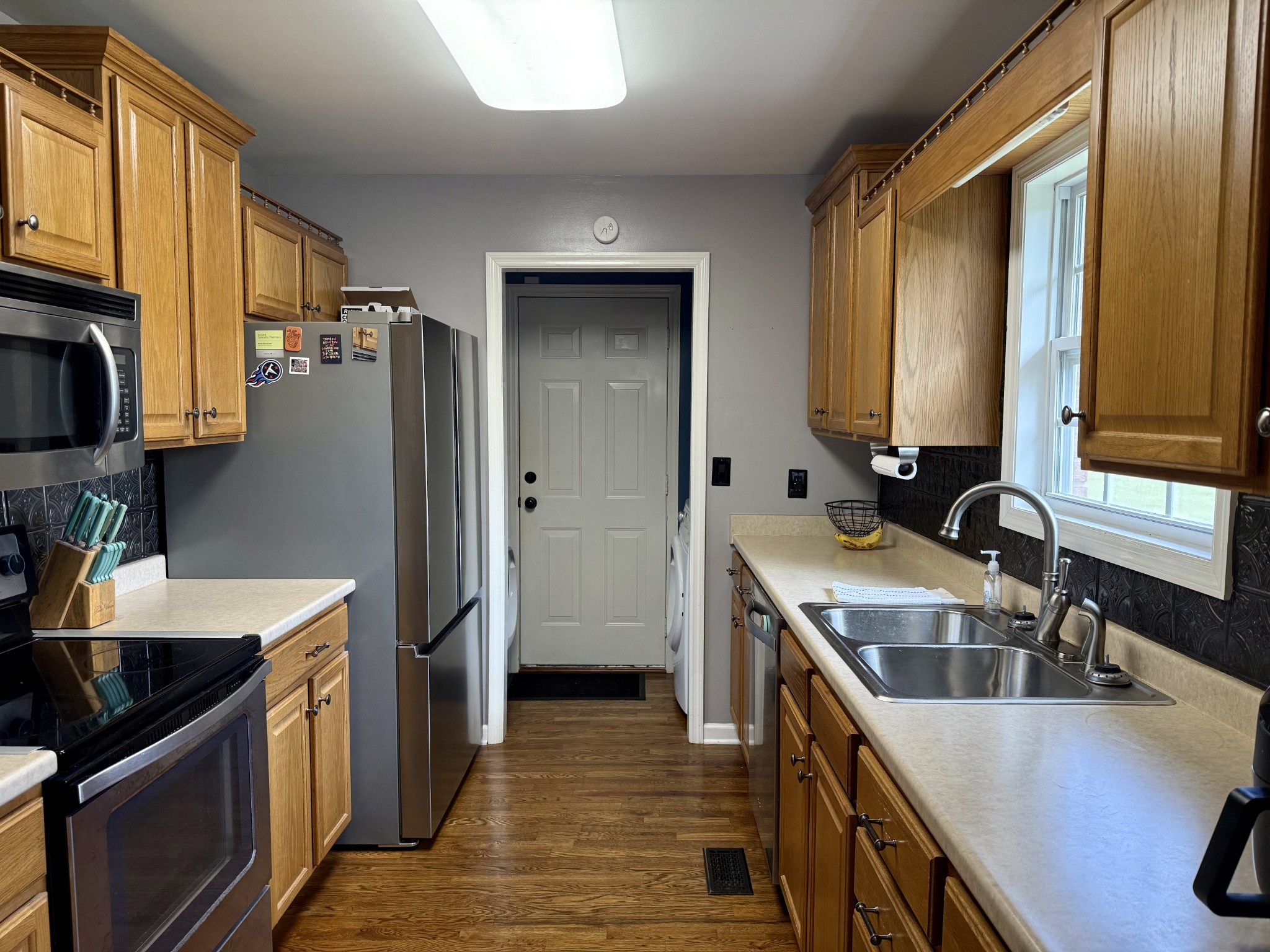 125 Maple Ridge Court McMinnville, TN 37110 - Photo 12 of 44 a kitchen with a sink stove and refrigerator