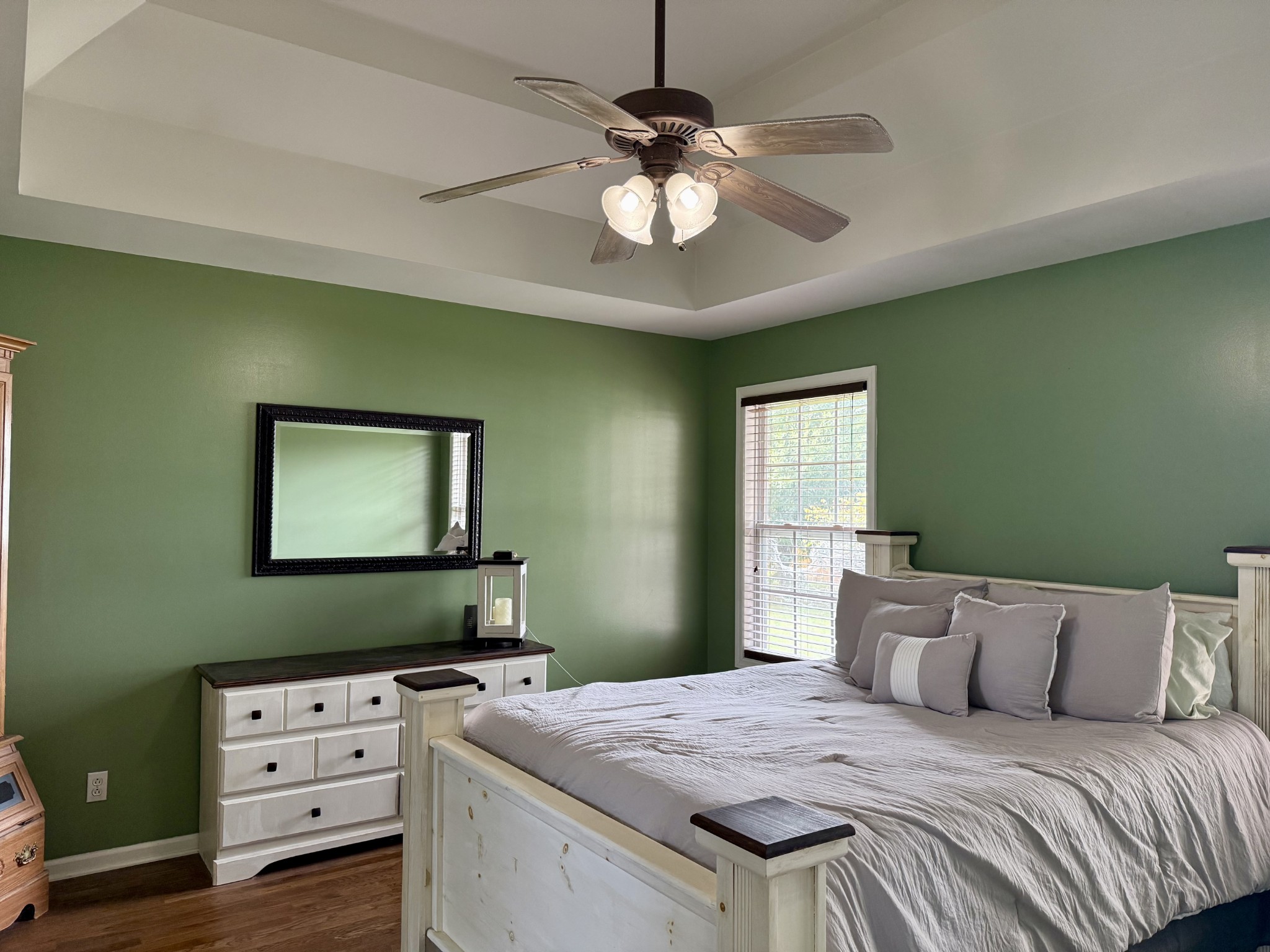 125 Maple Ridge Court McMinnville, TN 37110 - Photo 17 of 44 a bedroom with a bed and a chandelier