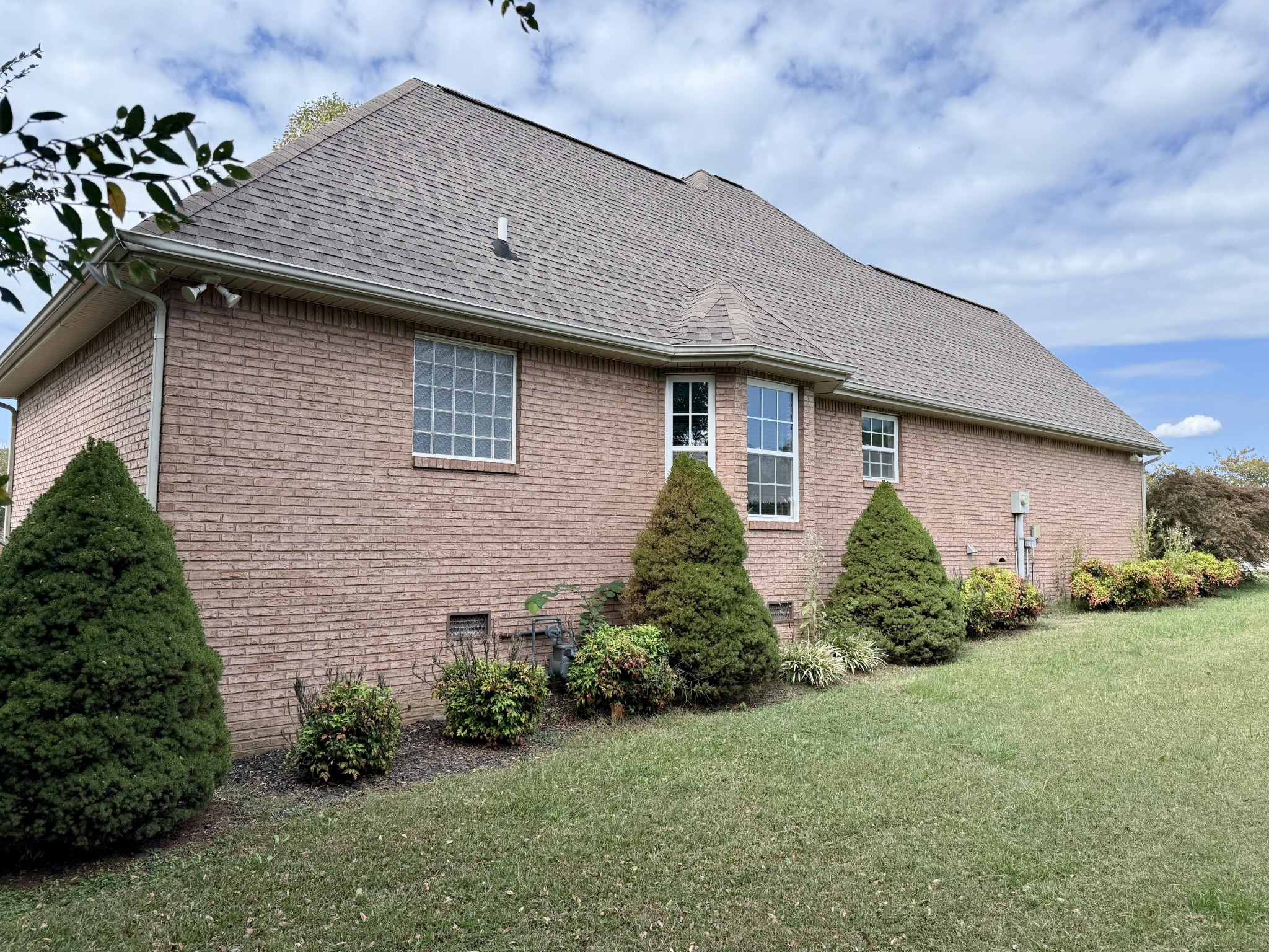 125 Maple Ridge Court McMinnville, TN 37110 - Photo 42 of 44 a brick house with potted plants