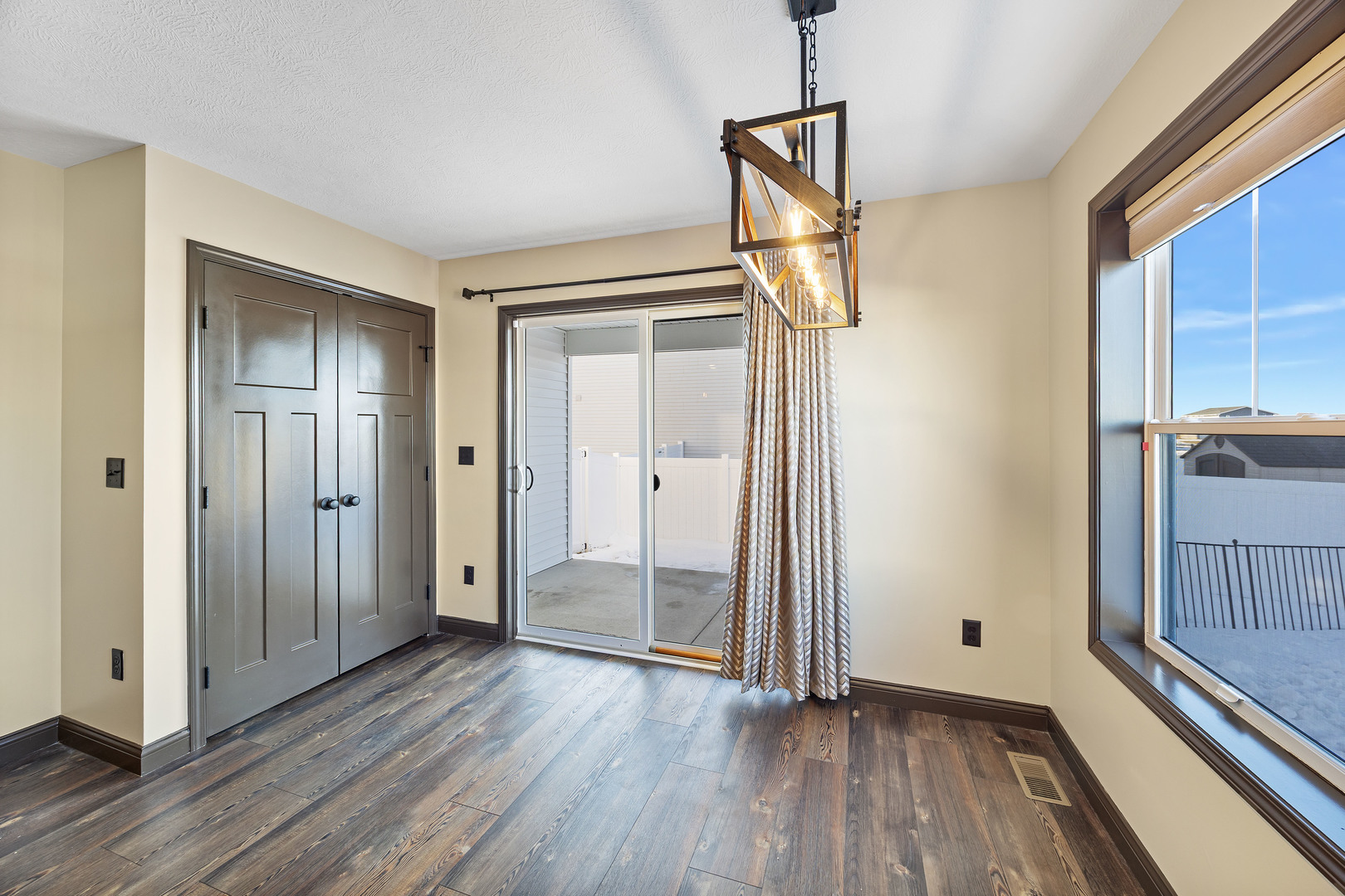 2172 Granby Lane Normal, IL 61761 - Photo 12 of 39 a view of empty room with wooden floor and fan