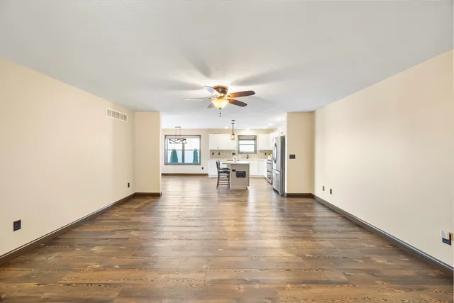 a view of a livingroom with wooden floor
