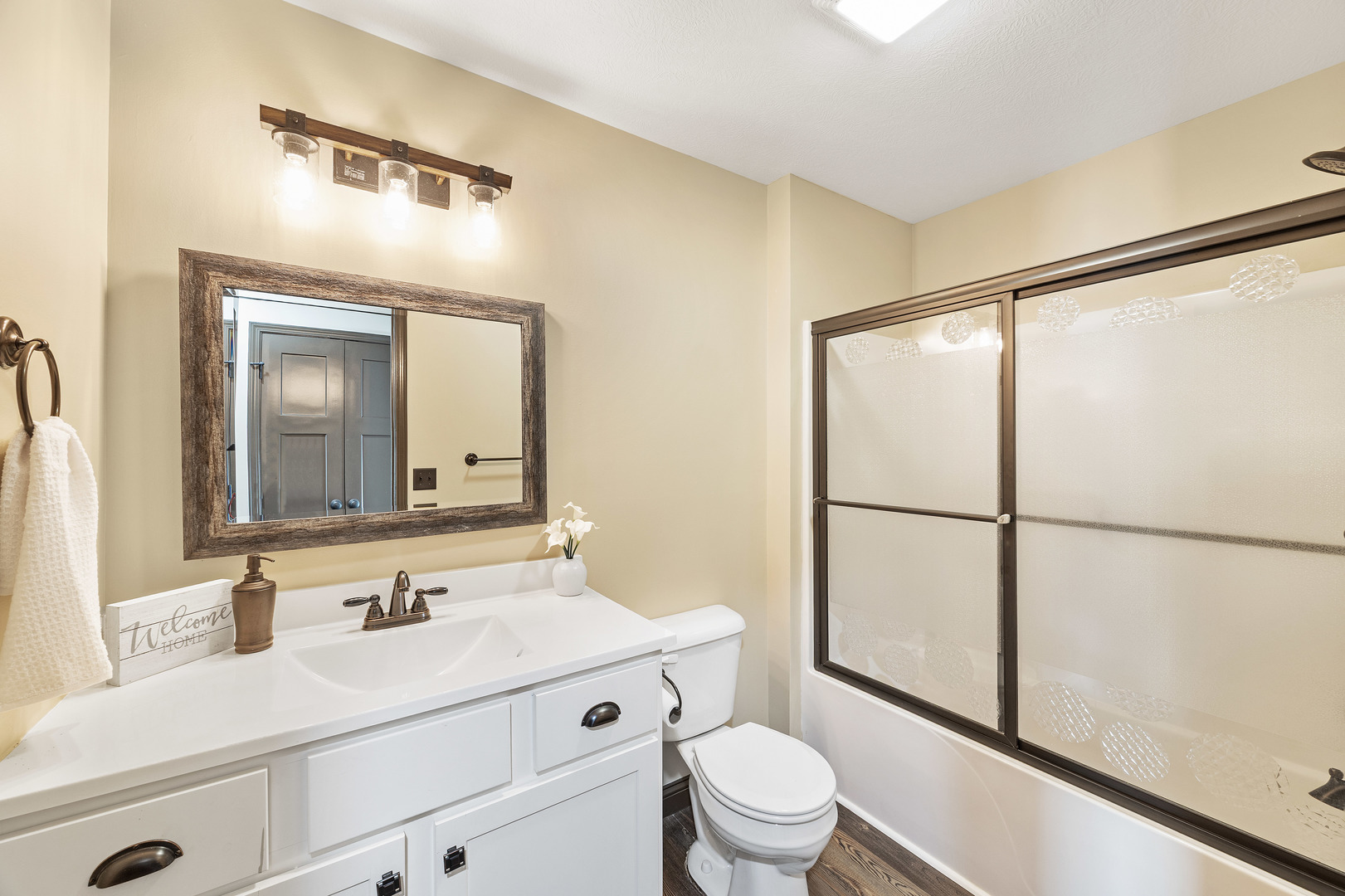 2172 Granby Lane Normal, IL 61761 - Photo 27 of 39 a bathroom with a sink a toilet a mirror and shower