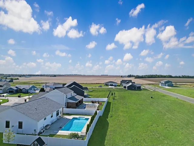 an aerial view of a house with a garden