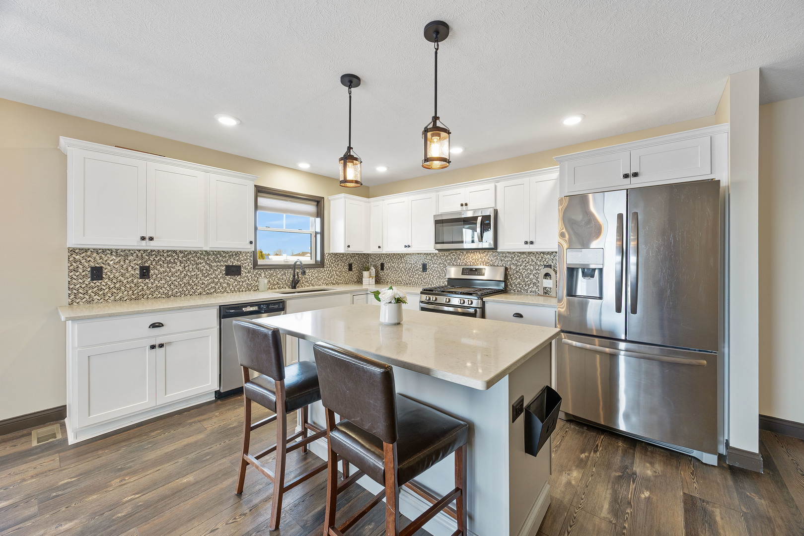 2172 Granby Lane Normal, IL 61761 - Photo 8 of 39 a kitchen with refrigerator cabinets and wooden floor