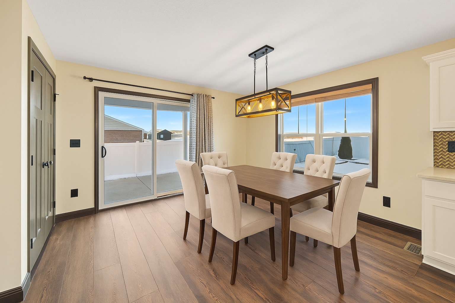 2172 Granby Lane Normal, IL 61761 - Photo 10 of 39 a view of a dining room with furniture window and wooden floor