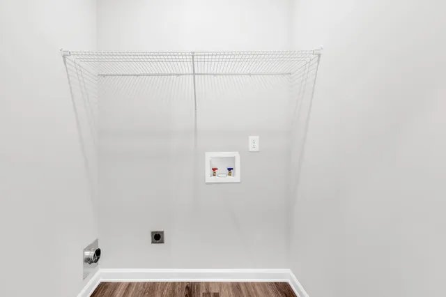 a front view of a building with a glass door and a window