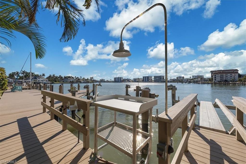 2825 Leeward Lane Naples, FL 34103 - Photo 34 of 44 a terrace with outdoor seating and city view