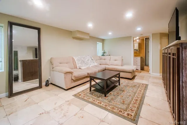 a living room with furniture a rug and a rug