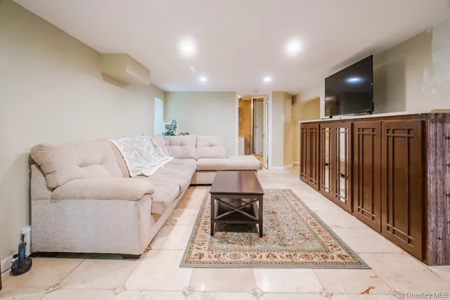 a bed sitting in a room next to a window