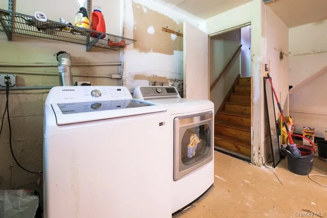 a balcony with wooden floor table and chairs