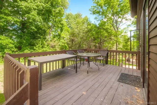 a view of backyard with a patio