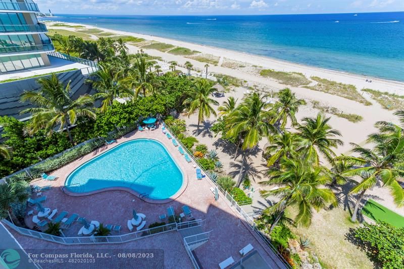 710 North Ocean Boulevard, Unit 706 Pompano Beach, FL 33062 - Photo 19 of 20 a view of a swimming pool with a yard