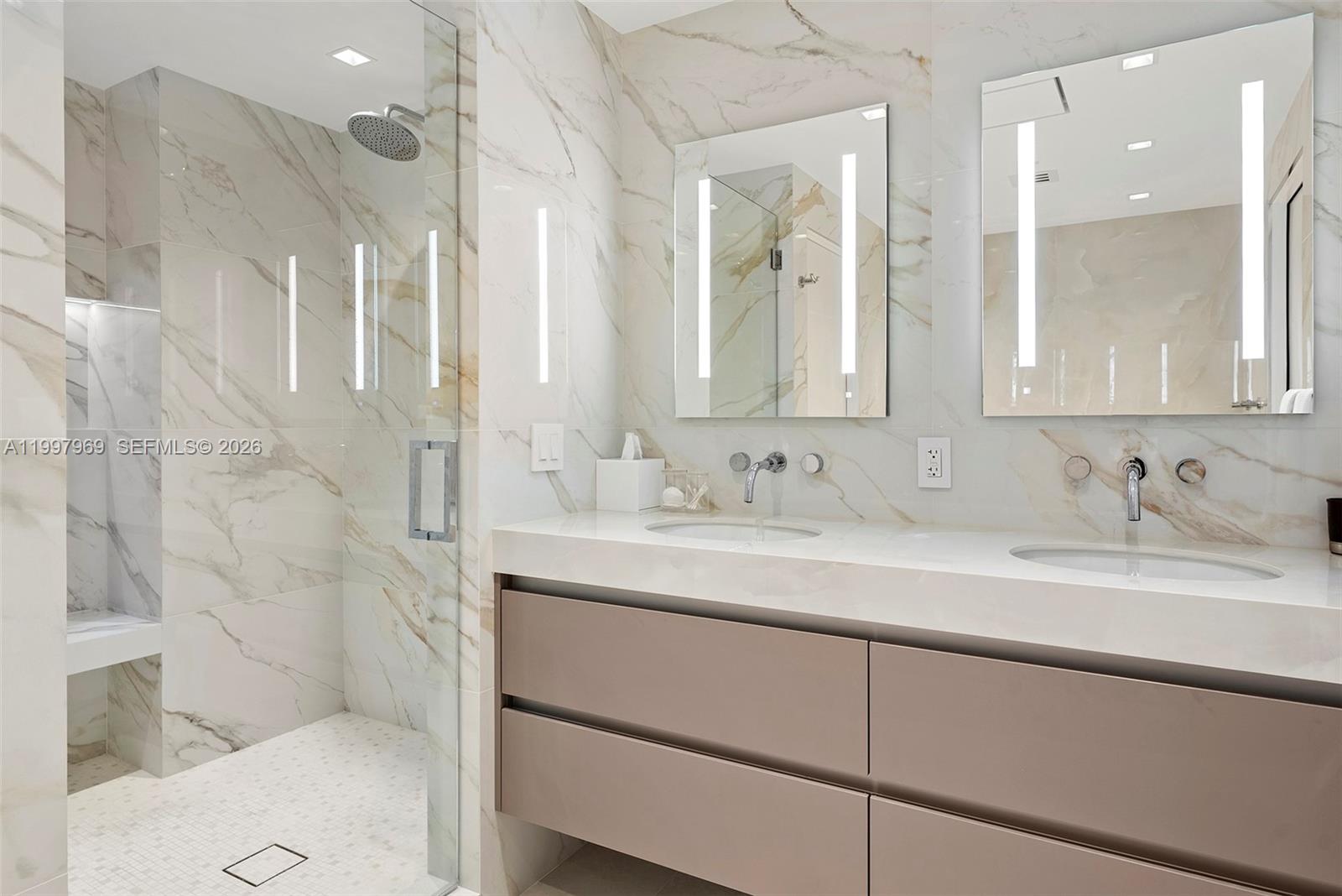 6899 Collins Avenue, Unit 1908 Miami Beach, FL 33141 - Photo 28 of 63 a bathroom with a sink and a mirror