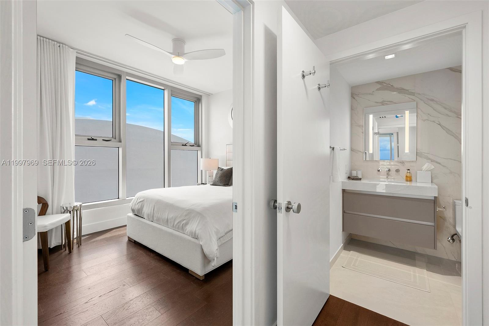6899 Collins Avenue, Unit 1908 Miami Beach, FL 33141 - Photo 45 of 63 a bathroom with a bathtub shower sink and toilet