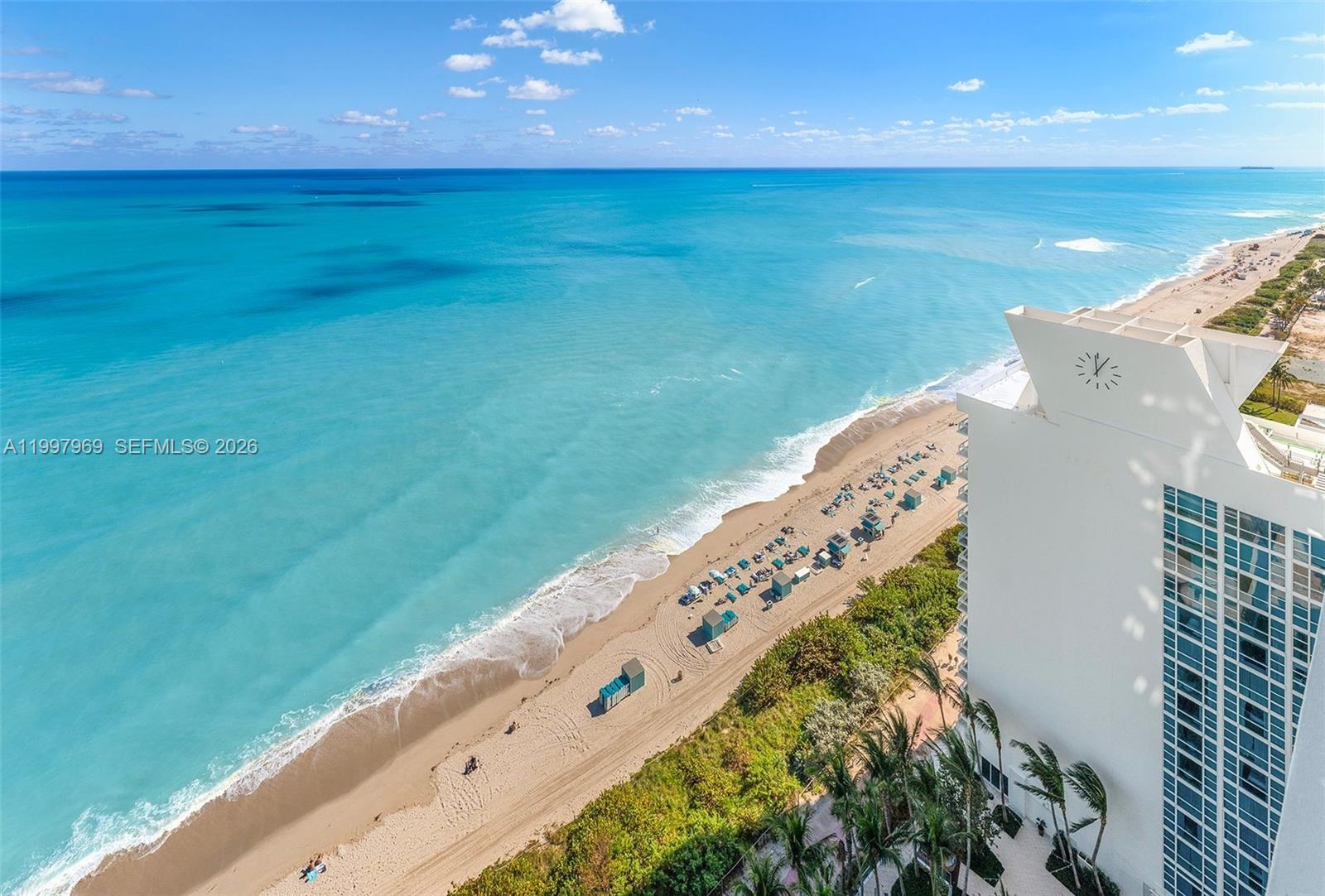 6899 Collins Avenue, Unit 1908 Miami Beach, FL 33141 - Photo 63 of 63 a view of an ocean from a balcony