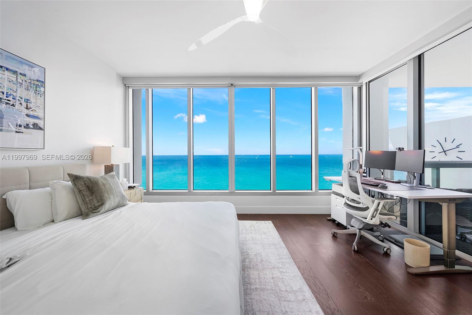 6899 Collins Avenue, Unit 1908 Miami Beach, FL 33141 - Photo 10 of 63 a bedroom with furniture and a large window