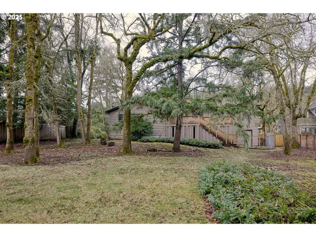 a backyard of a house with lots of green space
