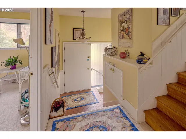 a utility room with cabinets washer and dryer