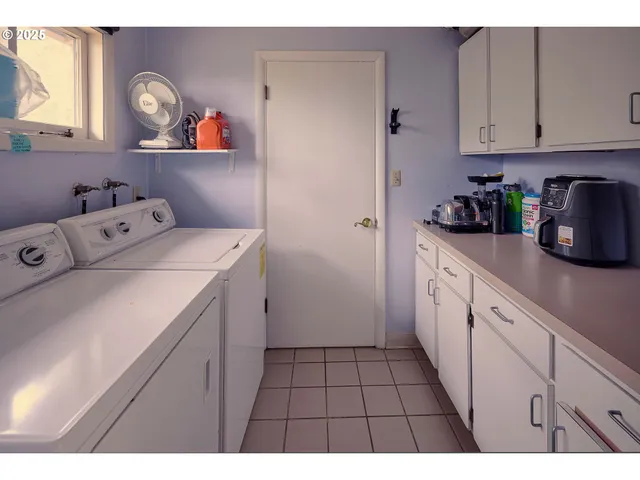 a utility room with dryer and washer