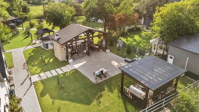 an aerial view of a house with a swimming pool