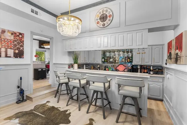 a kitchen with a dining table and chairs