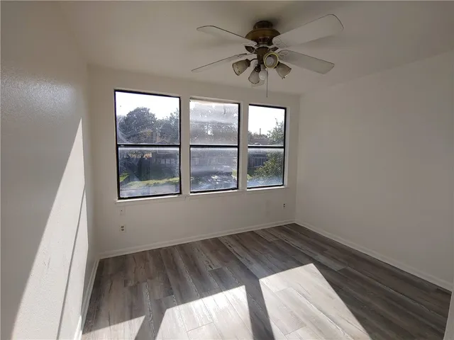 a view of empty room with windows