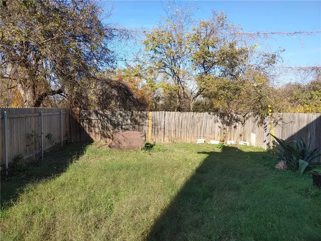 a view of backyard with green space