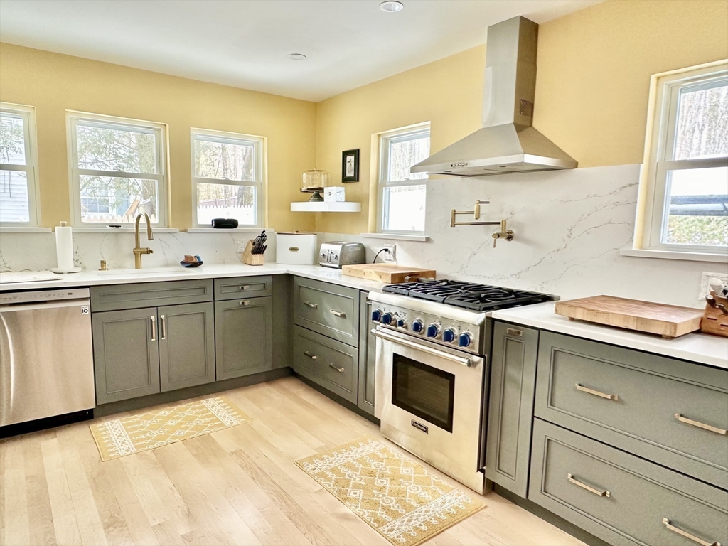 629 Florence Road Northampton, MA 01062 - Photo 3 of 36 a kitchen with a sink stove and cabinets
