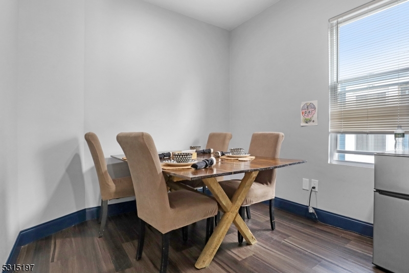 737 Jackson Avenue, Unit 2 Elizabeth, NJ 07201 - Photo 6 of 14 a view of a workspace with furniture and wooden floor
