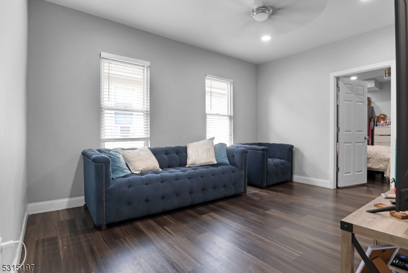 737 Jackson Avenue, Unit 2 Elizabeth, NJ 07201 - Photo 7 of 14 a living room with furniture and a window