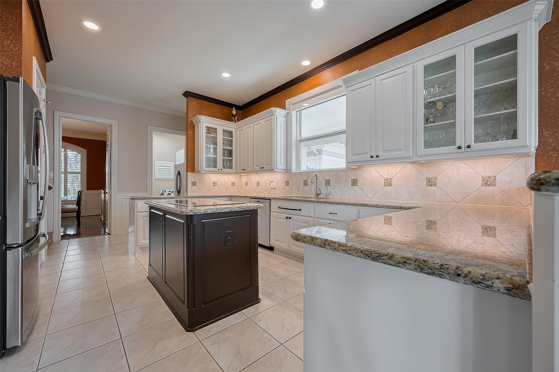 11826 Legend Manor Drive Houston, TX 77082 - Photo 15 of 43 Spacious gourmet island kitchen with stainless steel appliances, granite countertops, a wine fridge and double ovens.