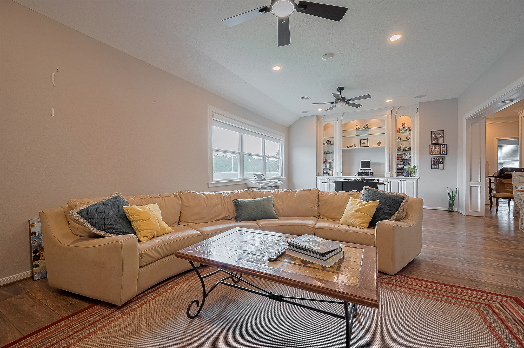 11826 Legend Manor Drive Houston, TX 77082 - Photo 29 of 43 Upstairs game room! Boasting recessed lights, ceiling fans, built in cabinetry, built-in speakers surround sound and at the windows, 100% black out shades for movie night!