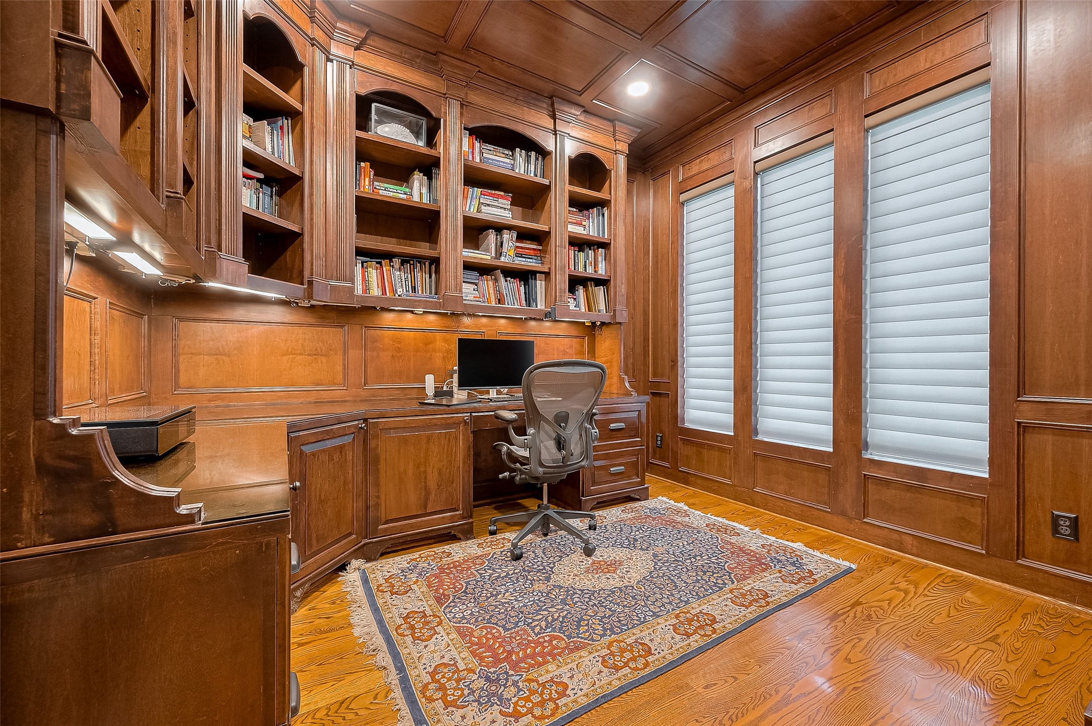 11826 Legend Manor Drive Houston, TX 77082 - Photo 9 of 43 Another view of the formal study with custom built in desk, under cabinet lighting and finished paneling. Please note the recessed lights and wood paneling on the ceiling!
