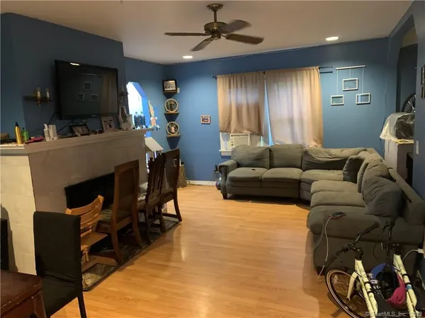 a living room with furniture and a flat screen tv