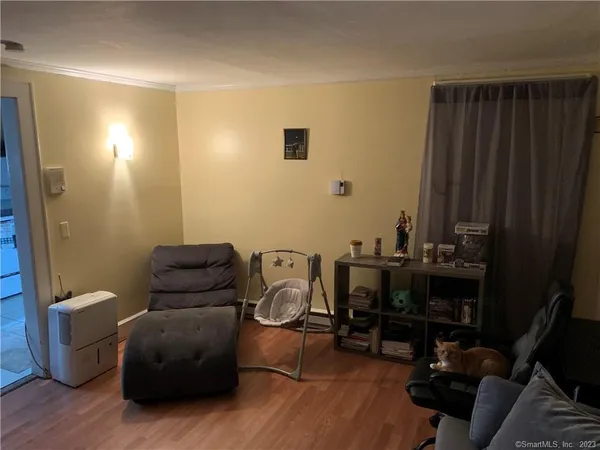 a view of a workspace with furniture and a gate