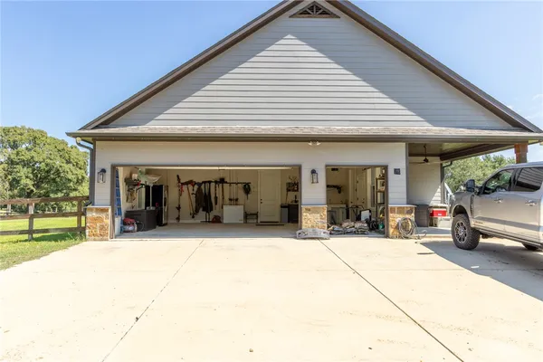 a view of a house with outdoor seating