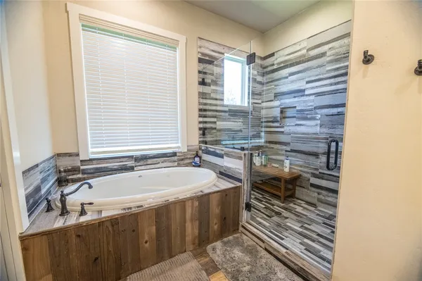 a bathroom with a bathtub and a sink