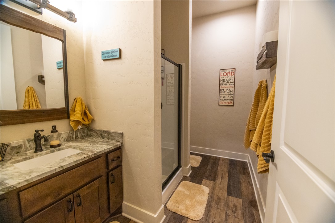 17497-495 Wilson Pasture Road Bryan, TX 77808 - Photo 29 of 50 a bathroom with a sink and a mirror