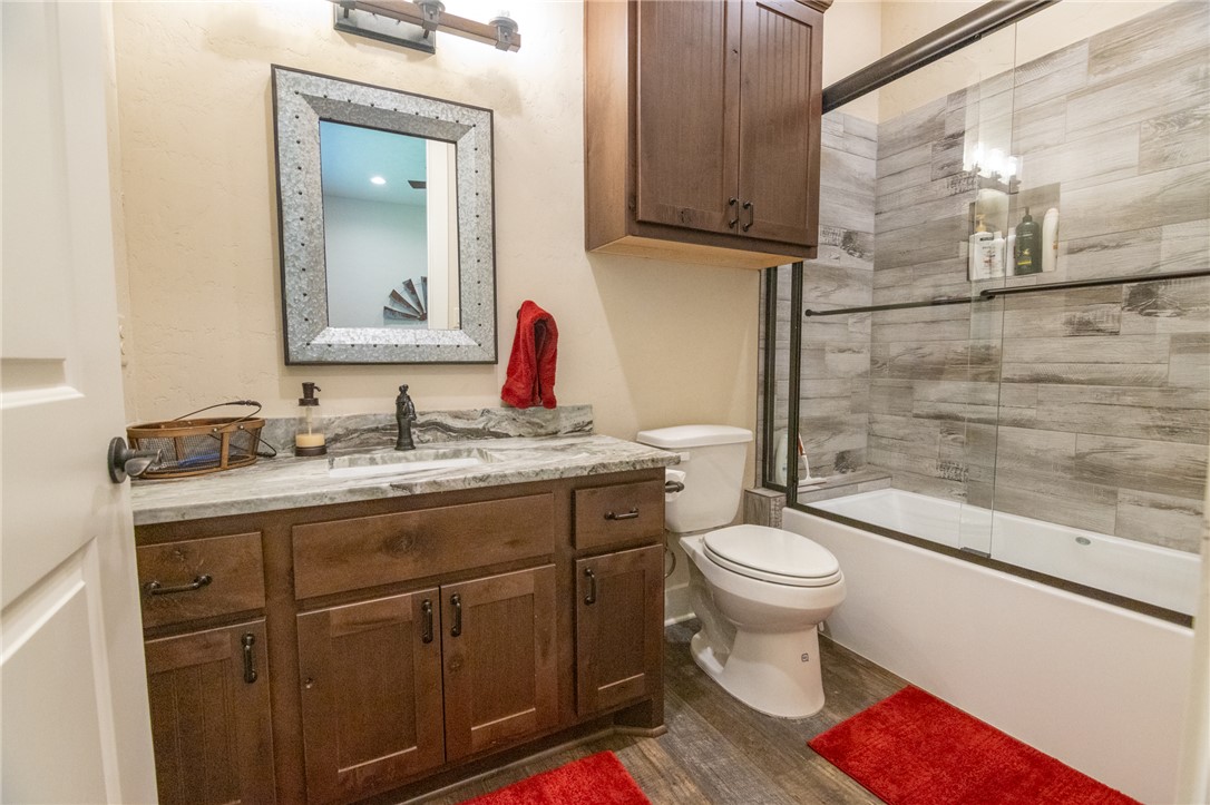 17497-495 Wilson Pasture Road Bryan, TX 77808 - Photo 30 of 50 a bathroom with a sink toilet and shower