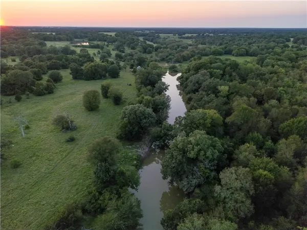 a view of a lake with green space