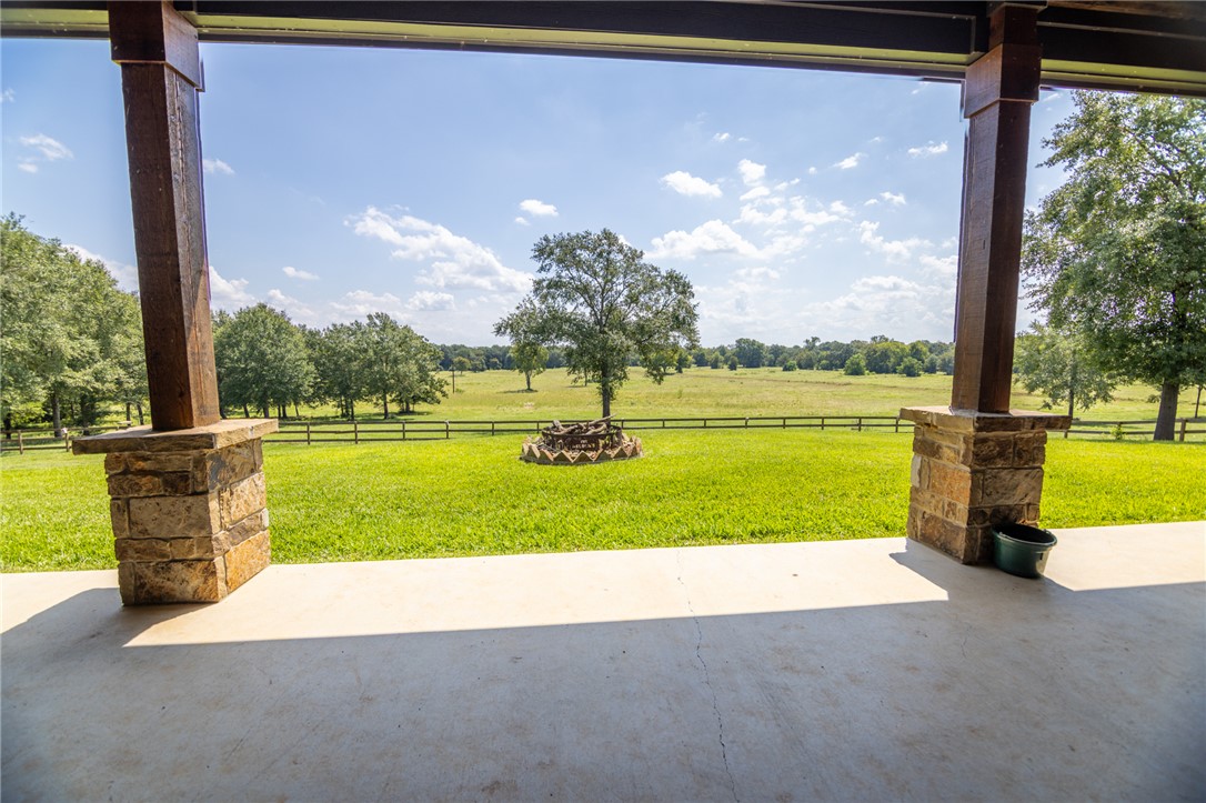 17497-495 Wilson Pasture Road Bryan, TX 77808 - Photo 31 of 50 a view of a garden with a swimming pool