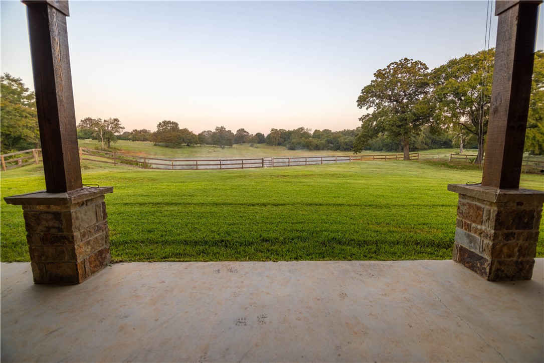 17497-495 Wilson Pasture Road Bryan, TX 77808 - Photo 32 of 50 a view of a ocean with a big yard and potted plants