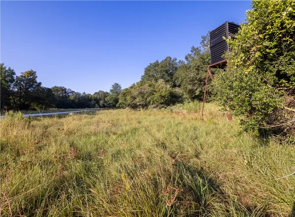 a view of lake with green space