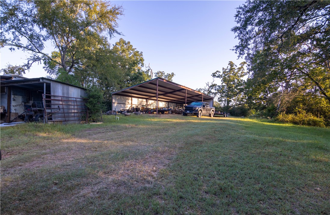 17497-495 Wilson Pasture Road Bryan, TX 77808 - Photo 42 of 50 a view of a house with a yard