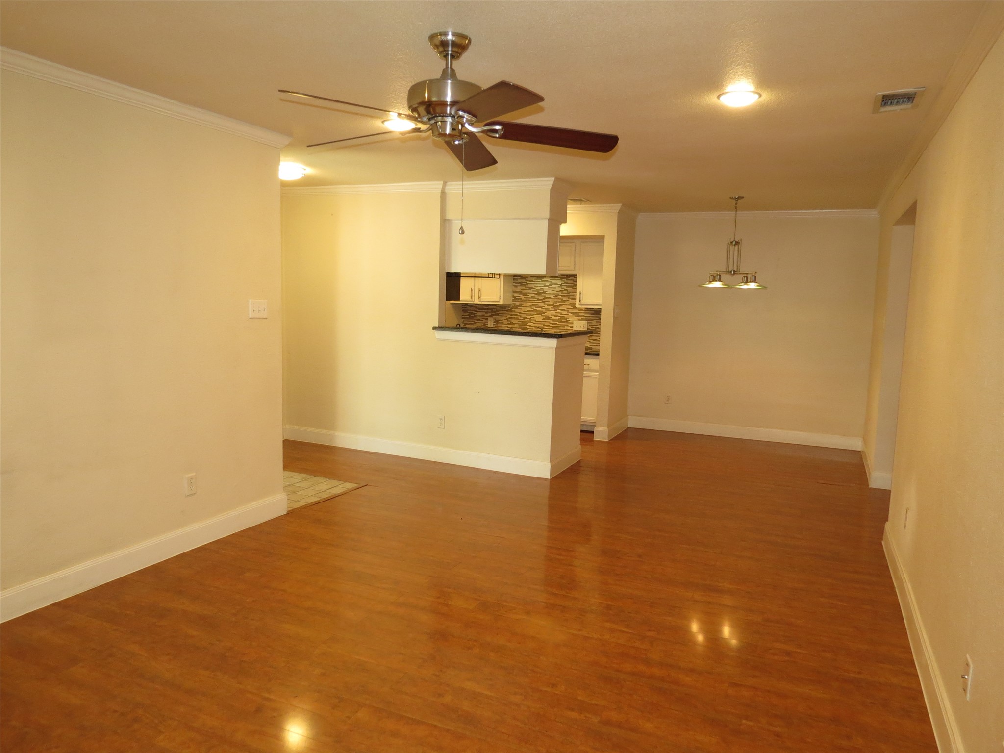 4159 Steck Avenue, Unit 269 Austin, TX 78759 - Photo 5 of 21 Rich hardwood flooring extends through this open-concept living area and into the adjacent dining space.